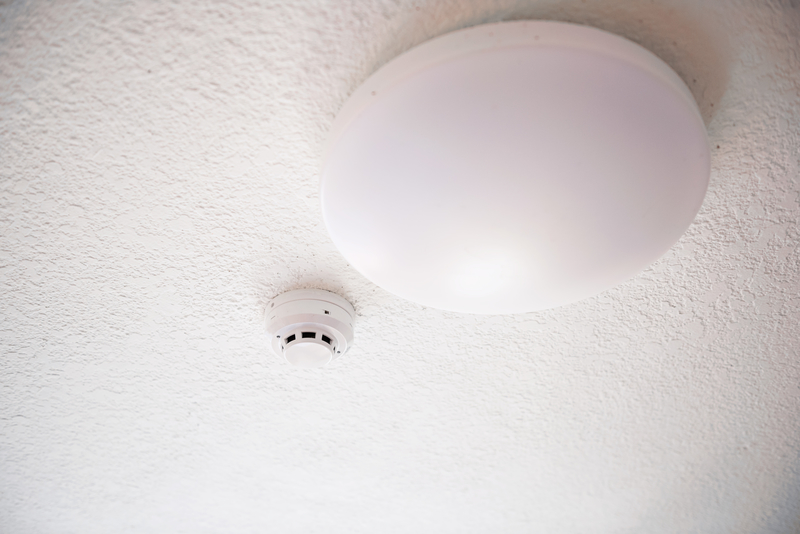 Smoke detector and fire protection system on ceiling.